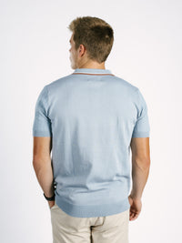 Light blue Georgia Southern men's ribbed polo shirt by Arena Graffiti, featuring the "GS" logo on the chest.