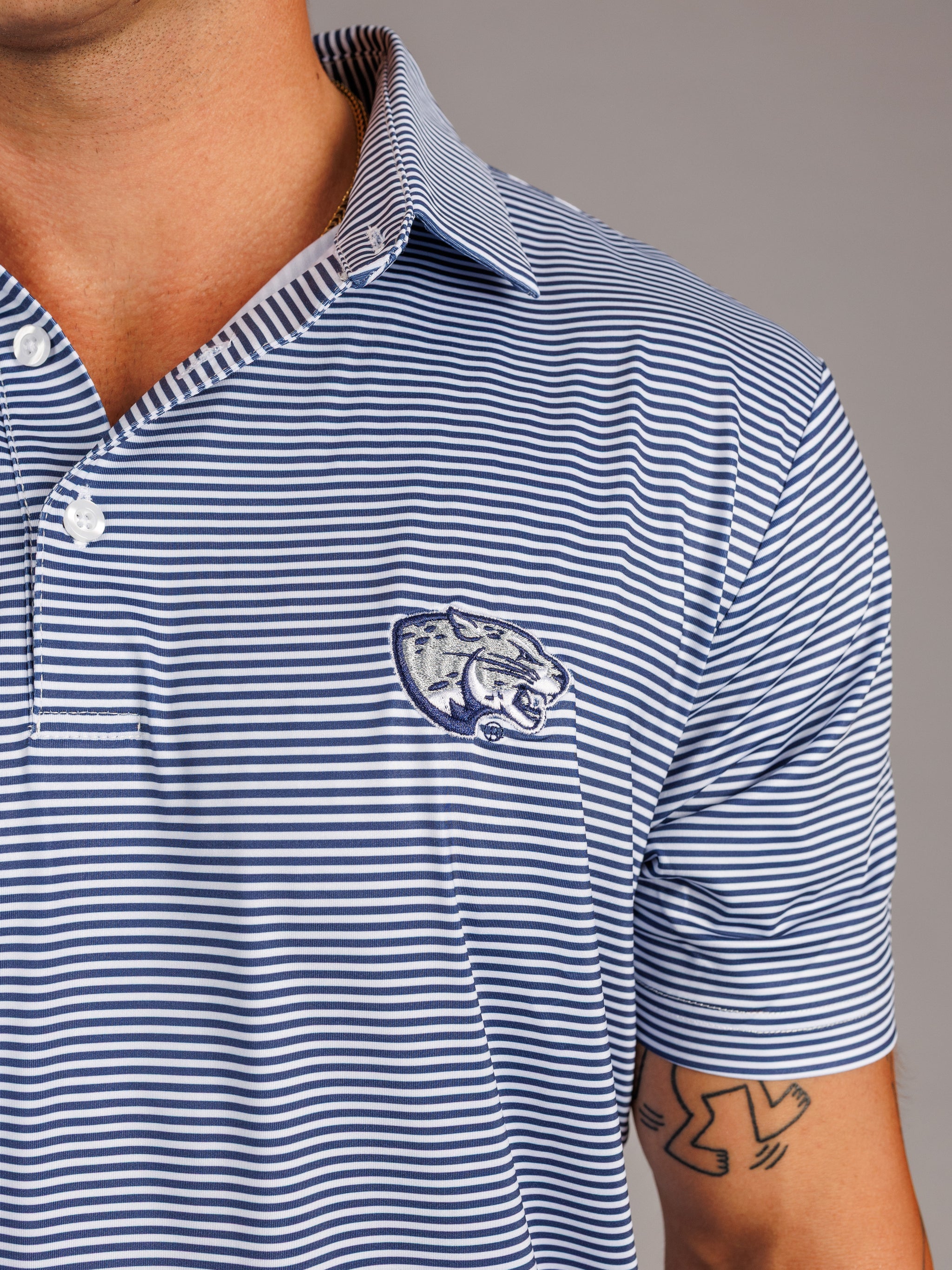 Arena Graffiti Augusta University men's Jag Head striped polo shirt featuring blue, white, and red horizontal stripes.