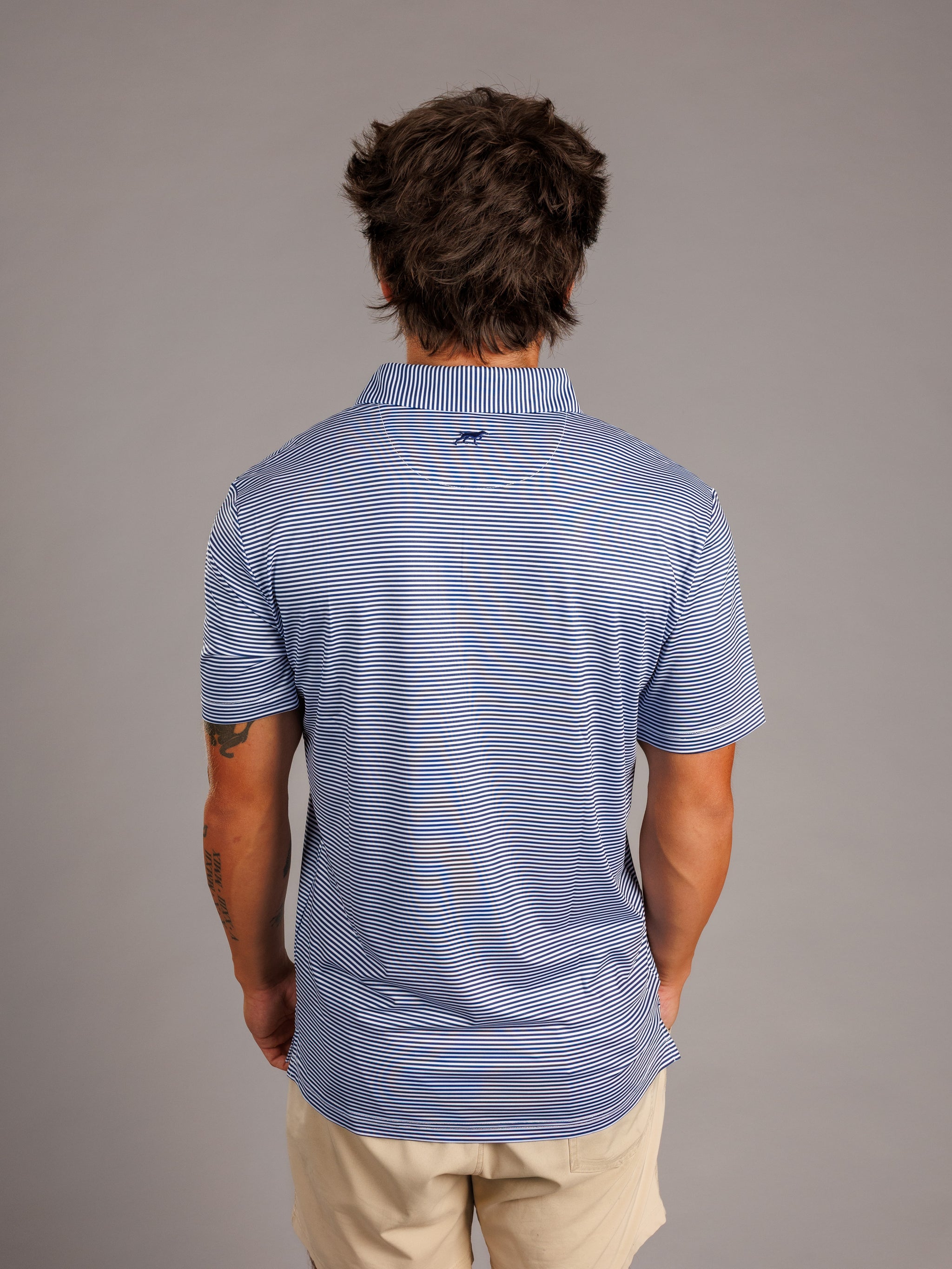 Arena Graffiti Augusta University men's "Jag Head" striped polo shirt, featuring university logo and classic collar design.