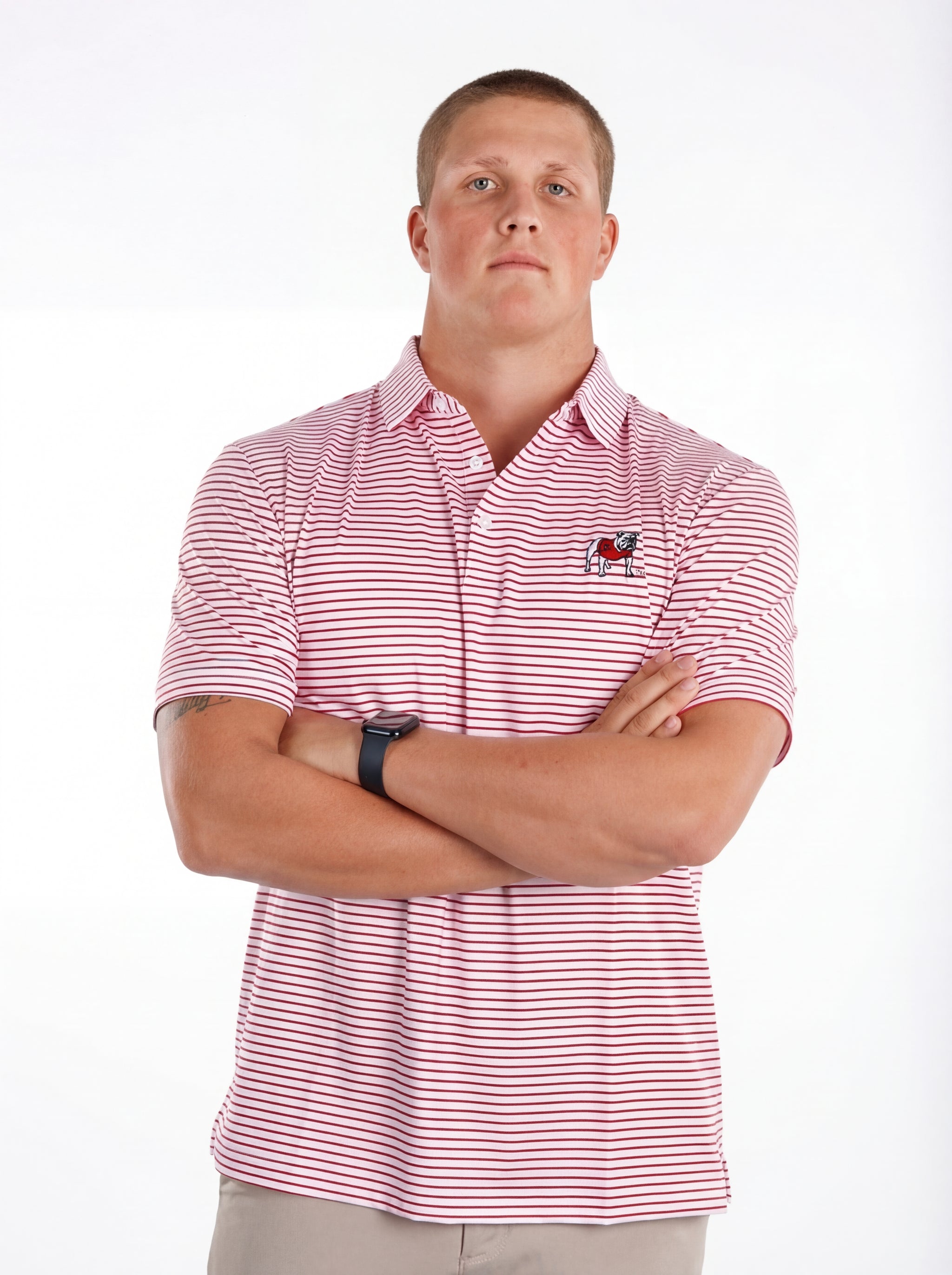 UGA Bulldogs men's "Standing Dawg" red and white striped polo shirt by Arena Graffiti, showing the front view with logo details.