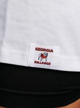UGA Bulldogs women’s “Standing Dawg Heavyweight” tee by Arena Graffiti featuring a graphic of the Dawg mascot on white cotton fabric.